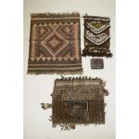 Two Middle Eastern carpet bags / pillows, an embroidered purse and a similar rug with a geometric