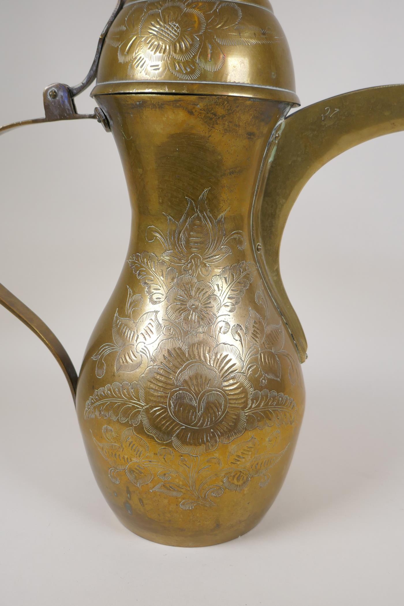 A Turkish brass coffee pot with chased floral decoration, 23½" high - Image 6 of 8