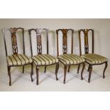 A set of four late Victorian high back parlour chairs on cabriole legs, the backs profusely inlaid