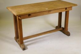 A continental elm draw leaf table on a refectory base, 54" x 39½", 30" high extended