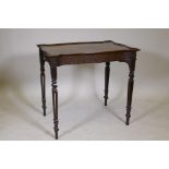 A mahogany Chippendale style silver table with serpentine shaped dished top and blind fret frieze,