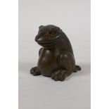 A Japanese style bronze okimono of a three legged toad, 2" high