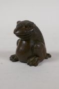A Japanese style bronze okimono of a three legged toad, 2" high