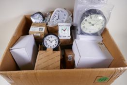 Fifty new and boxed alarm and travel clocks