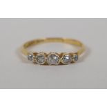 An 18ct yellow gold and platinum five stone diamond ring, size N/O, approx 1ct