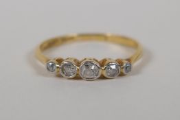 An 18ct yellow gold and platinum five stone diamond ring, size N/O, approx 1ct