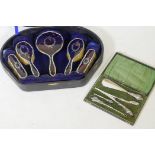 A hallmarked silver and tortoiseshell five piece dressing table set, cased, Birmingham 1924, W.J.