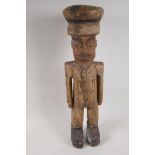 A carved wood figure of a soldier, 20" high