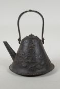 A Japanese Edo period iron teapot (Tetsubin) of Mount Fuji form, embossed with dragons and