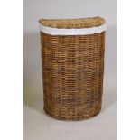 A wicker laundry basket, 31" high