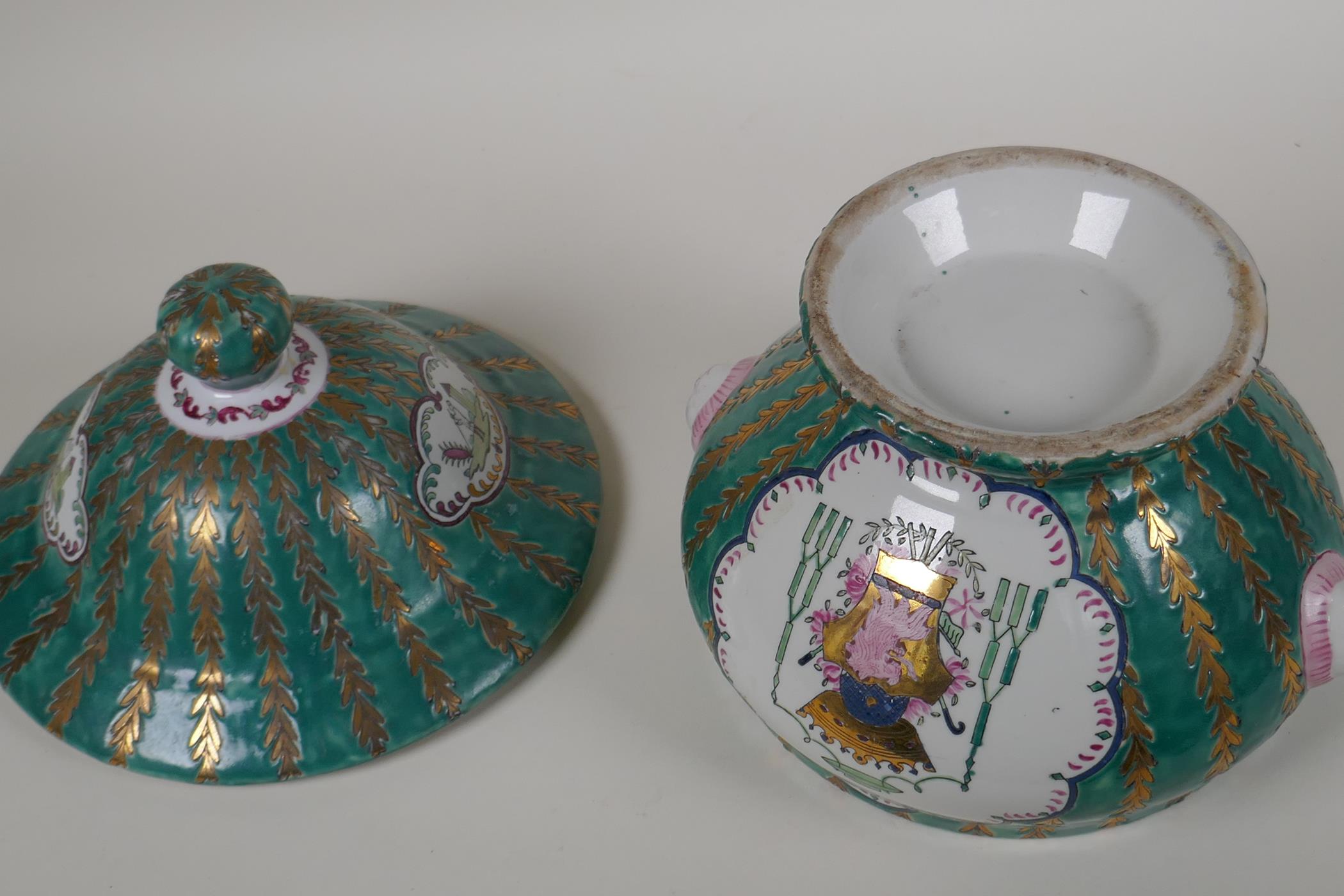 A Continental porcelain jar and cover with panels decorated with coats of arms, on a green and - Image 4 of 4