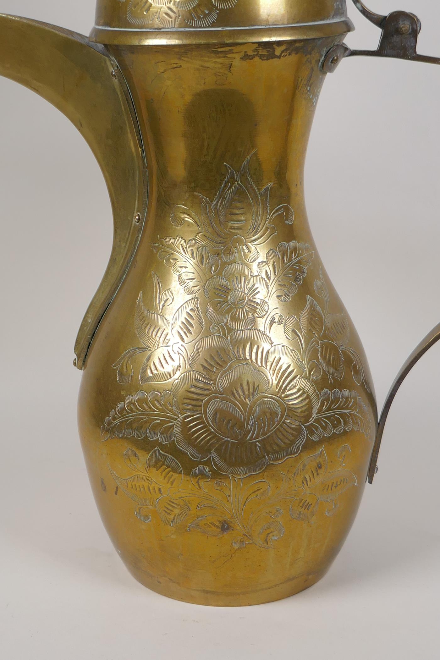 A Turkish brass coffee pot with chased floral decoration, 23½" high - Image 2 of 8