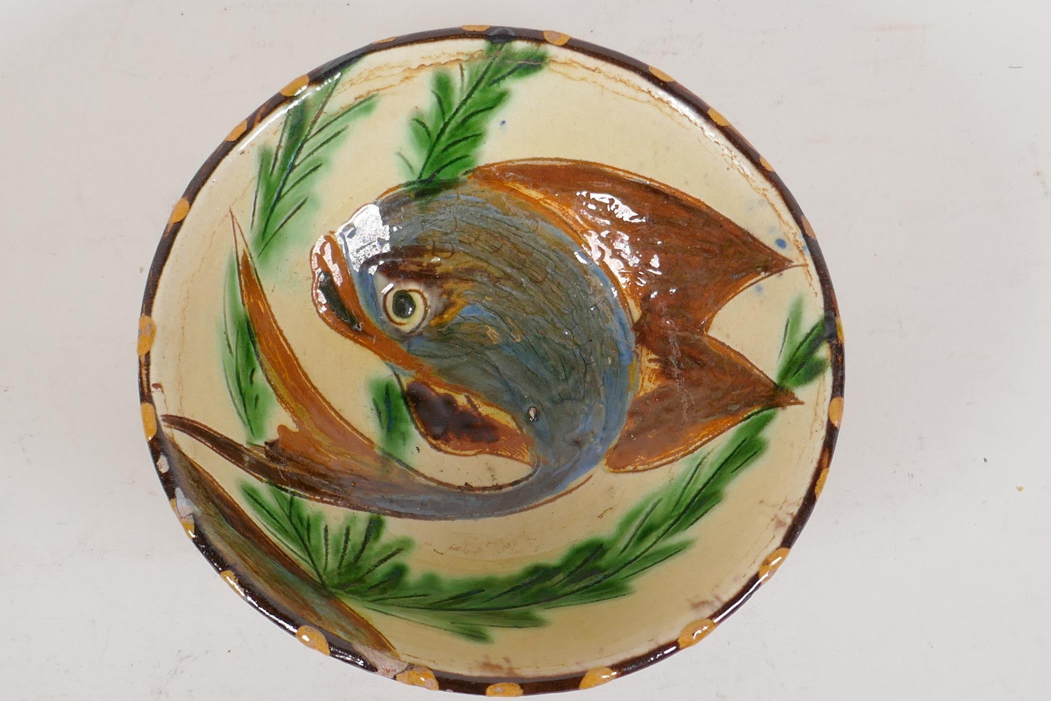 A Middle Eastern studio pottery red earthenware bowl with high fired drip glaze, the interior - Image 2 of 4