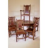 A 1930s oak drawleaf dining table, raised on barleytwist supports and six (4+2) chairs, ensuite, 36"