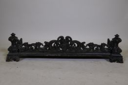 A Victorian cast iron fire surround with Rococo style decoration, 41" x 12" x 10"