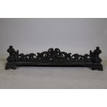 A Victorian cast iron fire surround with Rococo style decoration, 41" x 12" x 10"