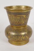 A small Islamic bronze vase with copper and silver applied decoration, 4½" high
