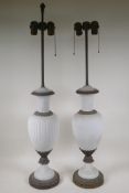 A pair of Parian ware table lamps with bronze mounts, 36" high, one finial missing