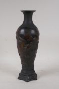 A Chinese bronze vase with raised decoration of a phoenix in flight, 6 character mark to base, 12"