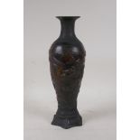 A Chinese bronze vase with raised decoration of a phoenix in flight, 6 character mark to base, 12"