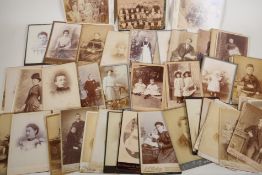 A quantity of Victorian portrait photographs and cartes de visites, 4" x 2½"