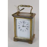 A French brass cased time peice carriage clock, with new platform escapement, white enamel dial