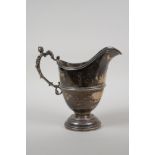 A hallmarked silver jug with a figural handle by George Nathan & Ridley Hayes, Chester 1901, 374g