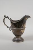 A hallmarked silver jug with a figural handle by George Nathan & Ridley Hayes, Chester 1901, 374g