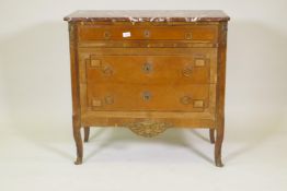 A French late C19th Louis XV style inlaid kingwood three drawer commode, with rouge marble top and