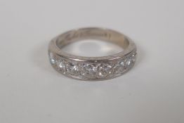 An 18ct white gold and diamond set half eternity ring, approx 1.7cts, size T/V