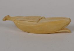 A Japanese Meiji period okimono carved as a banana, 5½" long