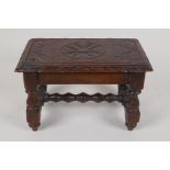 A small oak footstool with carved top and bobbin turned legs and stretcher, 11" x 7" x 6½"