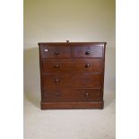 A Victorian mahogany chest of two over three drawers, with bun handles and lower cushion drawer,