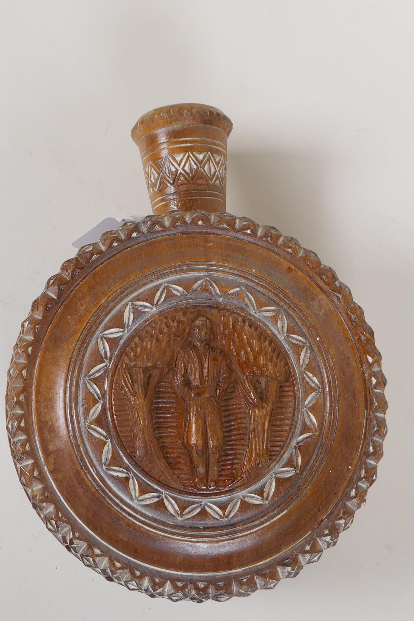 A Continental carved wood cased wine flask carved with male and female figures, 6½" diameter - Image 2 of 4