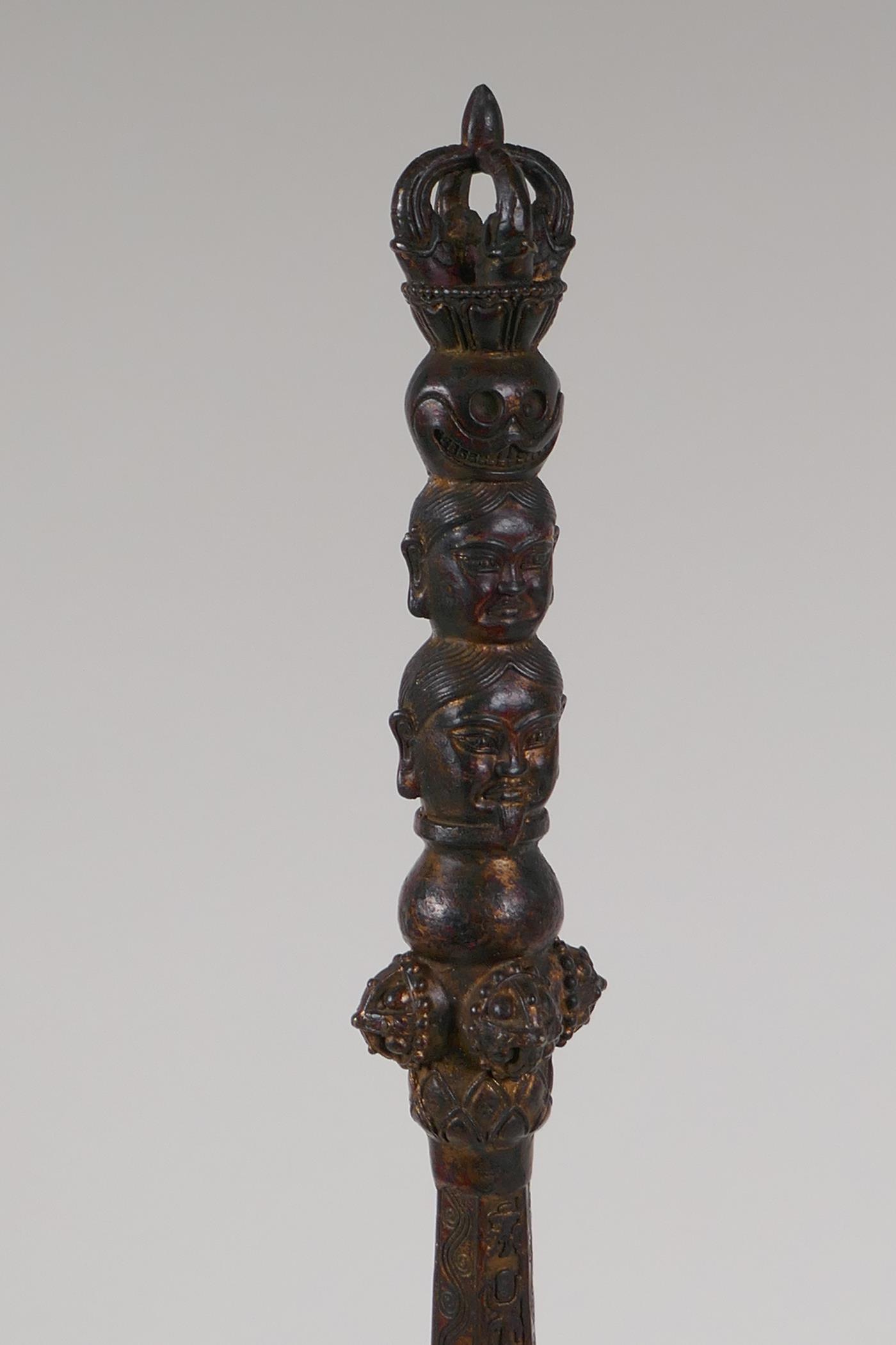 A Sino Tibetan bronze ceremonial sceptre with vajra and deity mask decoration, mounted on a - Image 2 of 5