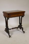 A good Victorian marquetry inlaid rosewood games table, the fold over top opening to reveal a