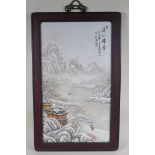 A Chinese Republic porcelain panel depicting a snowy river landscape scene, in a hardwood frame,