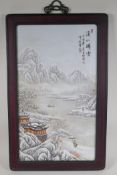 A Chinese Republic porcelain panel depicting a snowy river landscape scene, in a hardwood frame,