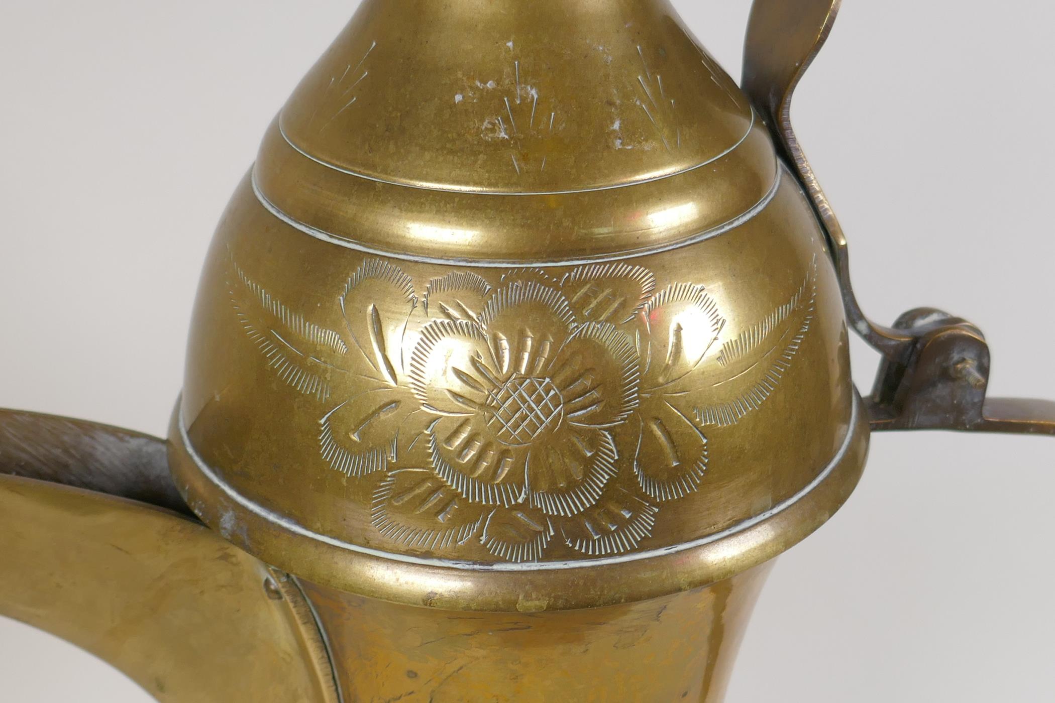 A Turkish brass coffee pot with chased floral decoration, 23½" high - Image 3 of 8
