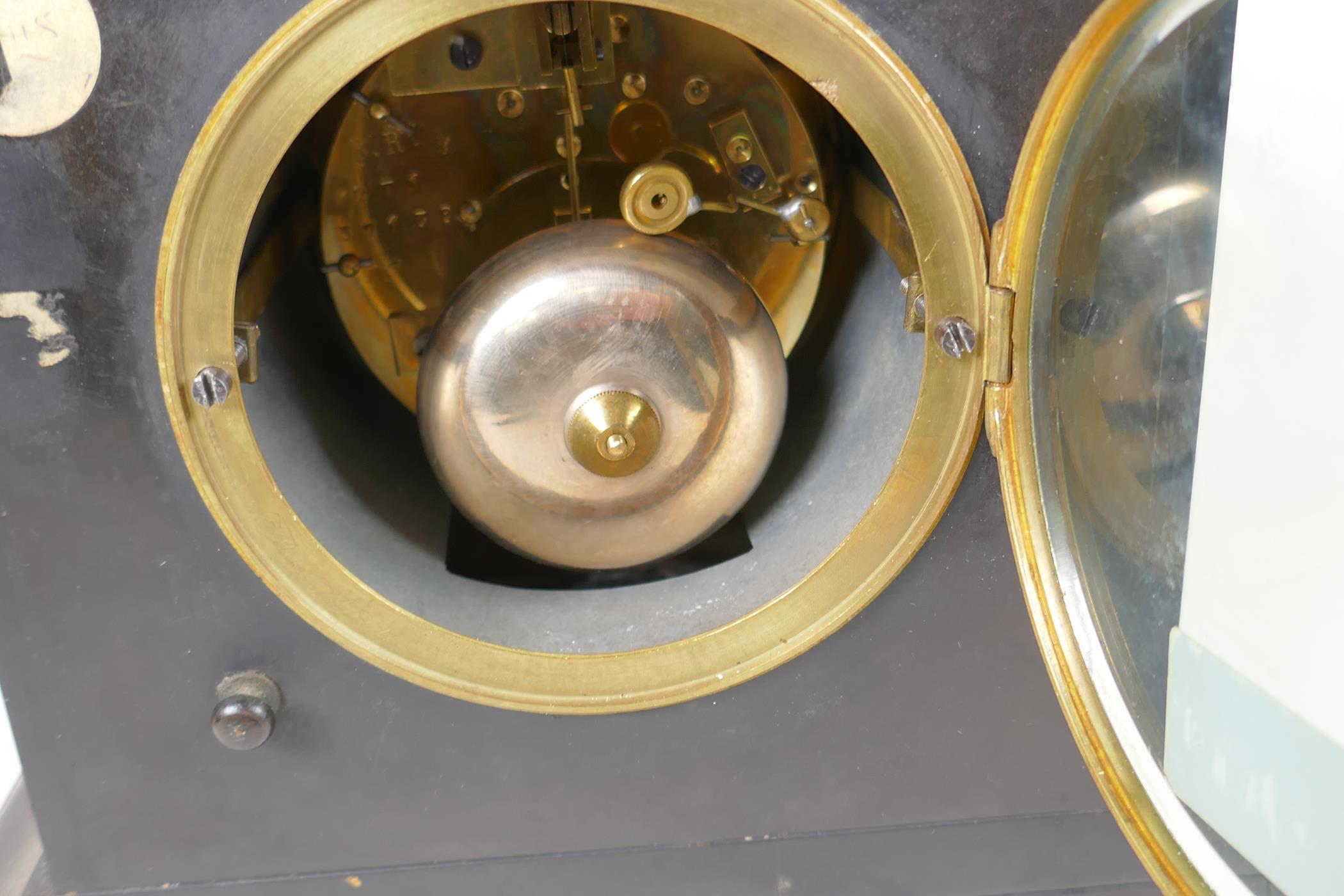 A slate and marble mantel clock with striking movement on a bell, white enamel dial and Roman - Image 4 of 4