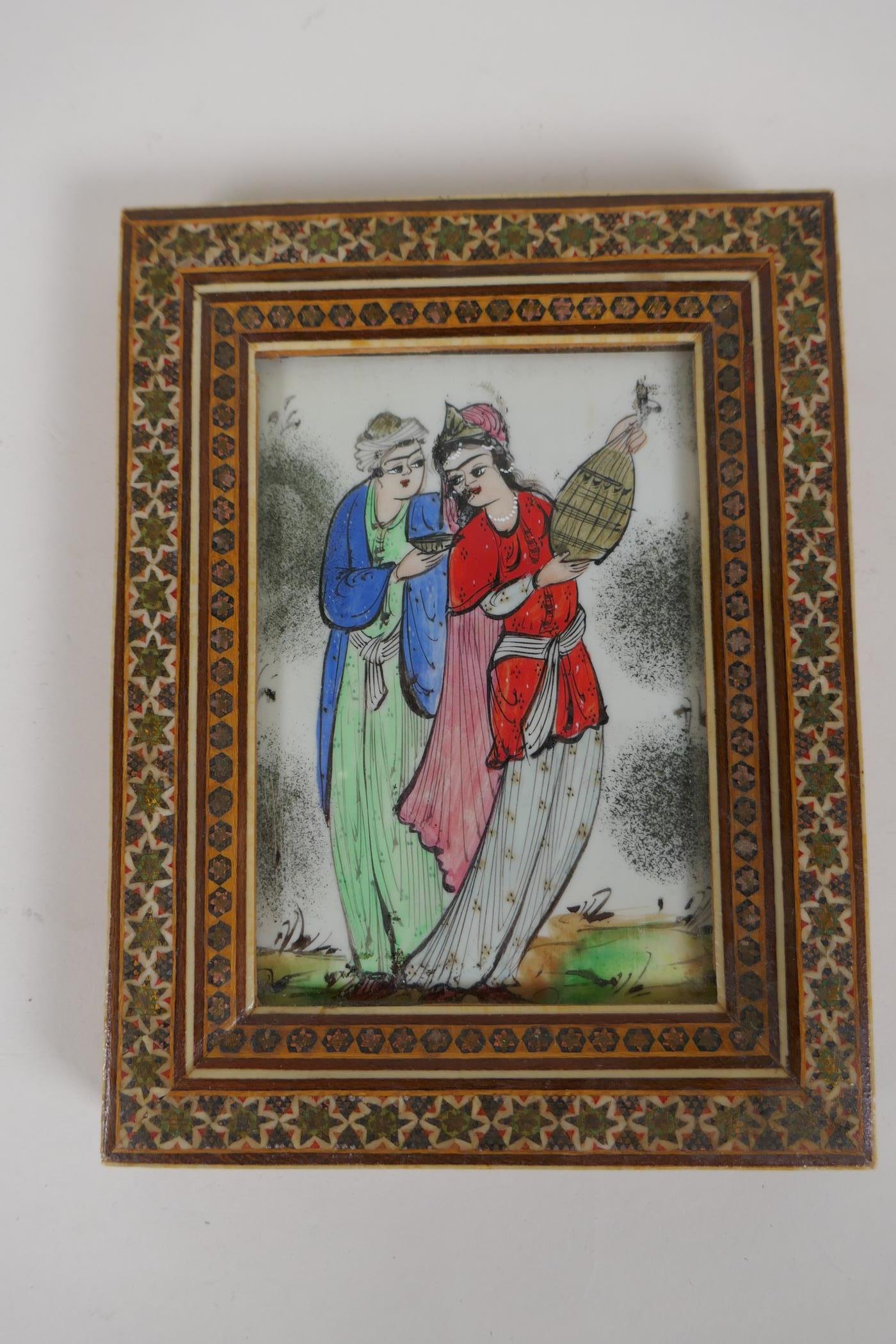 A Persian painting in a micro mosaic frame of a courting couple, 7" x 5½" overall - Image 3 of 3