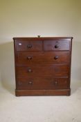 A Victorian mahogany chest of two over three drawers, with bun handles and lower cushion drawer,