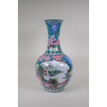 A Chinese polychrome porcelain vase with two decorative panels depicting riverside landscape scenes,