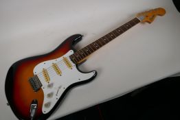 A 1970s Japanese built Columbs Stratocaster guitar in Sunburst finish, 40" long, comes with soft gig