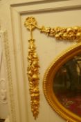 Architectural salvage, a large painted pine overmantel mirror with carved and gilded decoration,