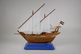 A scratch built model of a Dhow flying a UAE flag, with a fitted case, 19½" long
