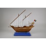 A scratch built model of a Dhow flying a UAE flag, with a fitted case, 19½" long