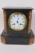 A slate and marble mantel clock with striking movement on a bell, white enamel dial and Roman