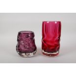 An amethyst studio glass vase and a similar cranberry studio glass vase, largest 7½" high