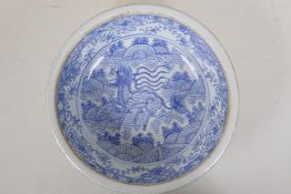 A late C19th Chinese blue and white porcelain steep sided dish with kylin decoration, 10" diameter